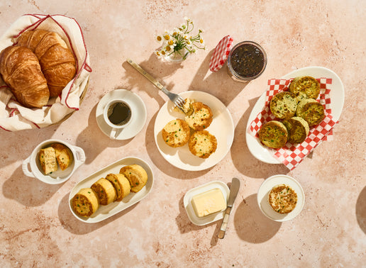 Breakfast spread with Egg Bites, coffee, and butter on a textured surface